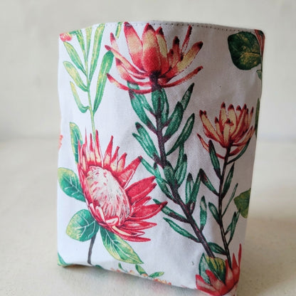 Floral patterned car bin with red and green flowers on a white background
