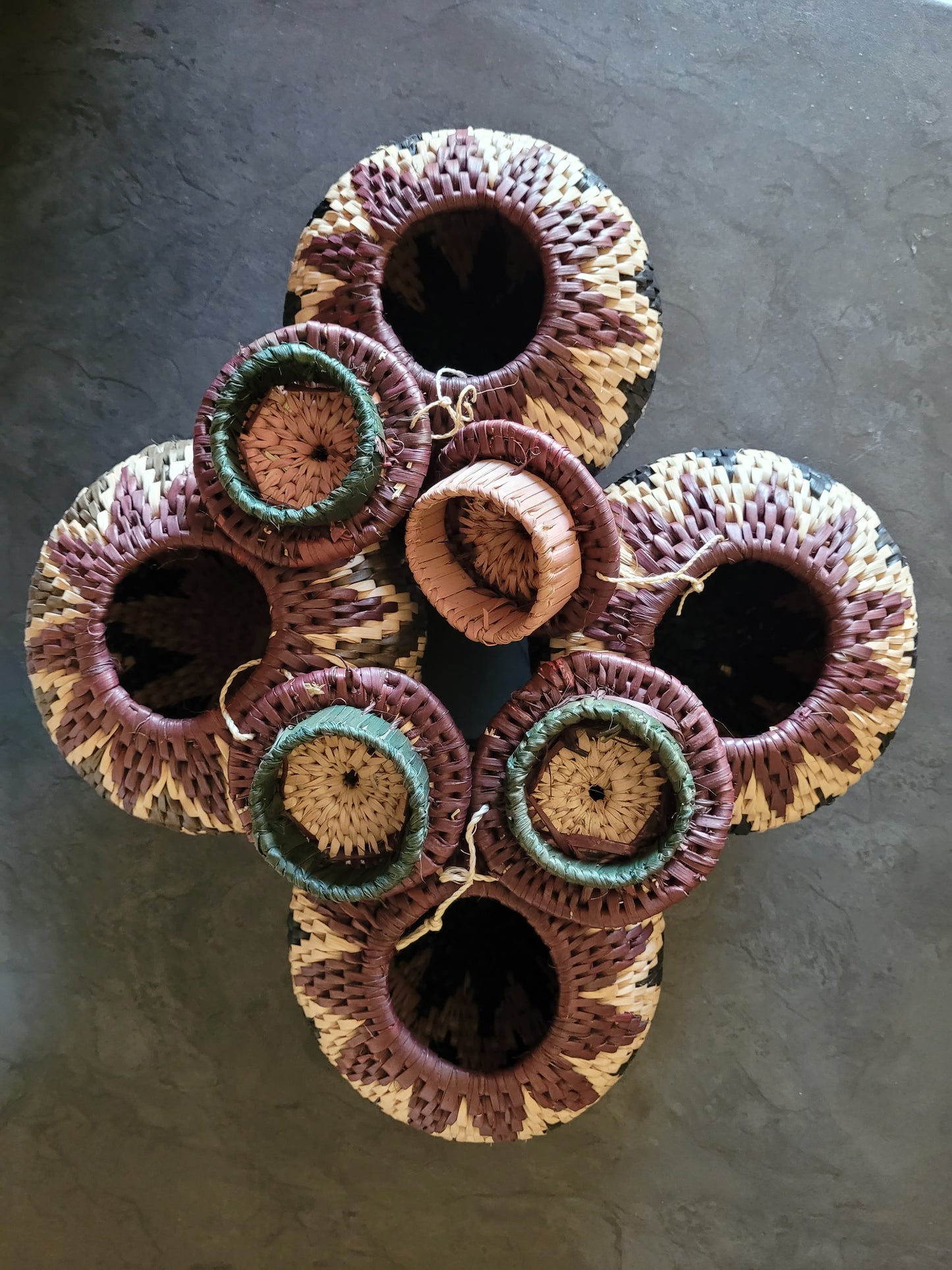 Set of woven baskets on a dark surface