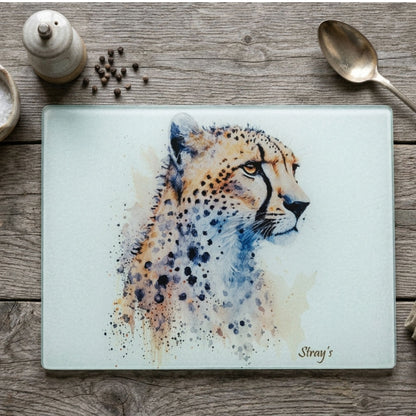 Glass cutting board with a cheetah design on a wooden surface