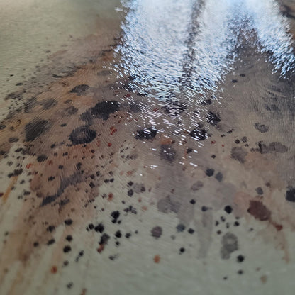 Close-up of a textured surface with speckles and patterns